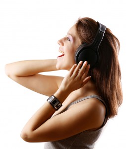 Girl singing with headphones.