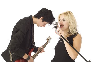 Guy playing Guitar and Female Singer.